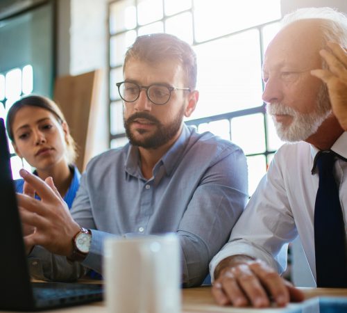 employees explaining something to their client employees explaining something to their client