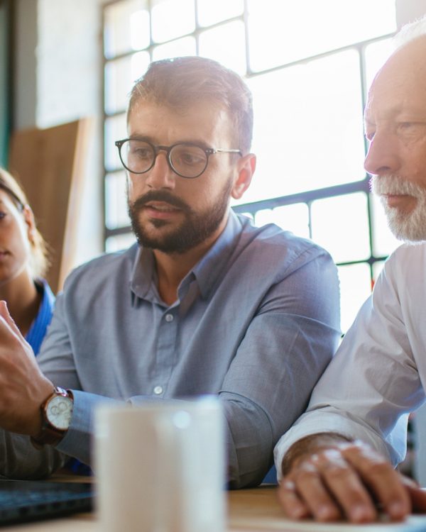 employees explaining something to their client employees explaining something to their client